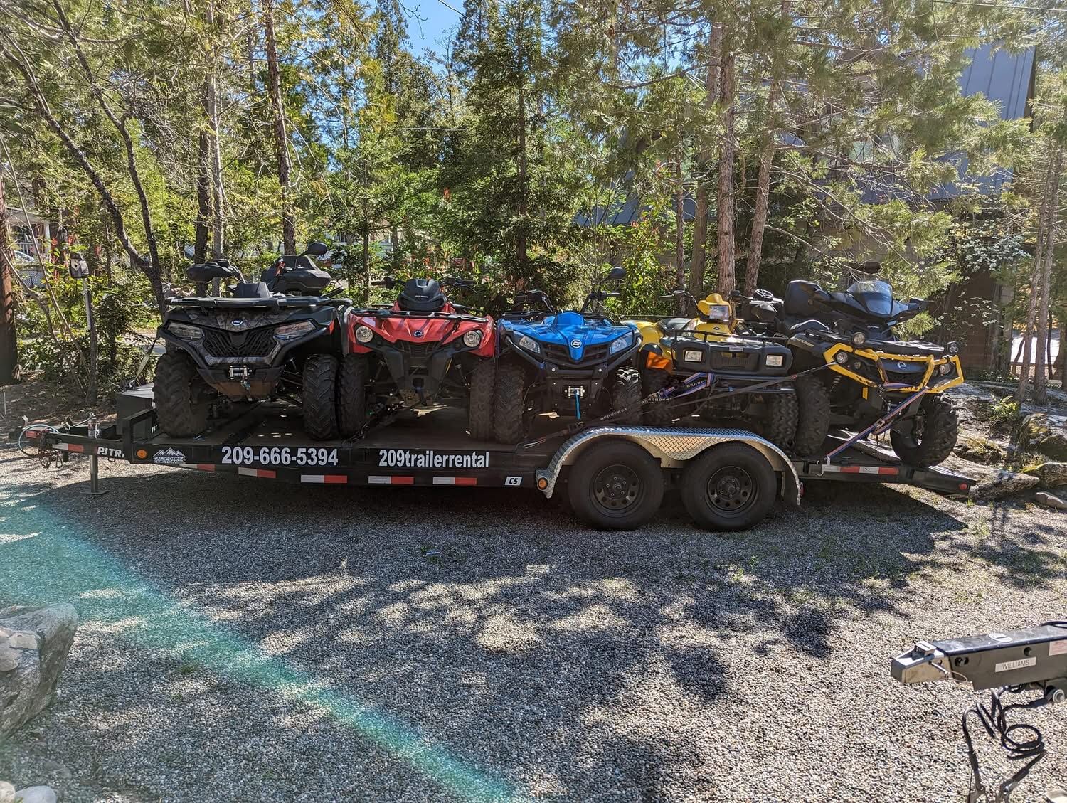 Five quads loaded on the trailer — ready to roll out