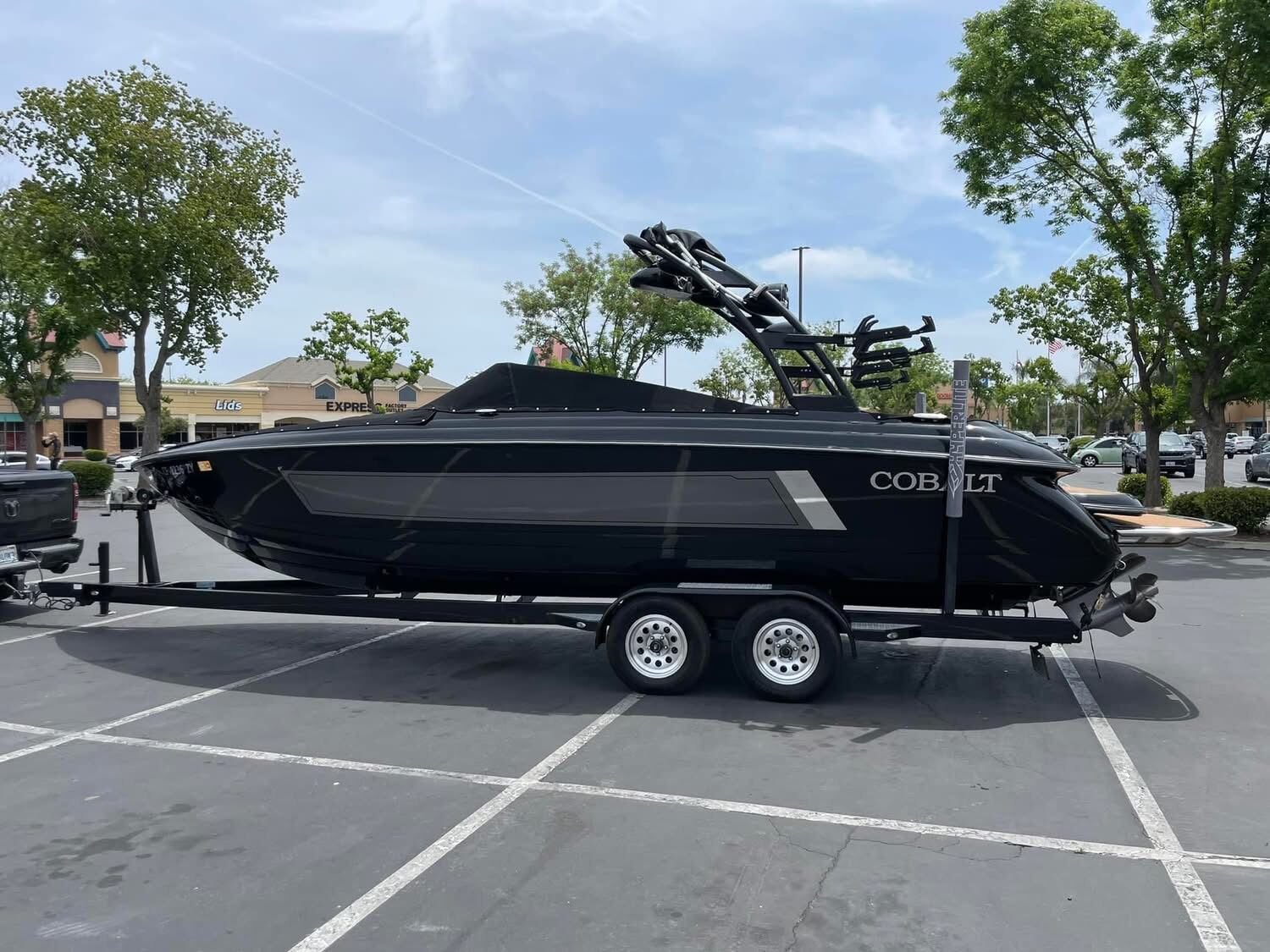 Cobalt on the trailer in profile — wakeboard tower up, ready for the lake