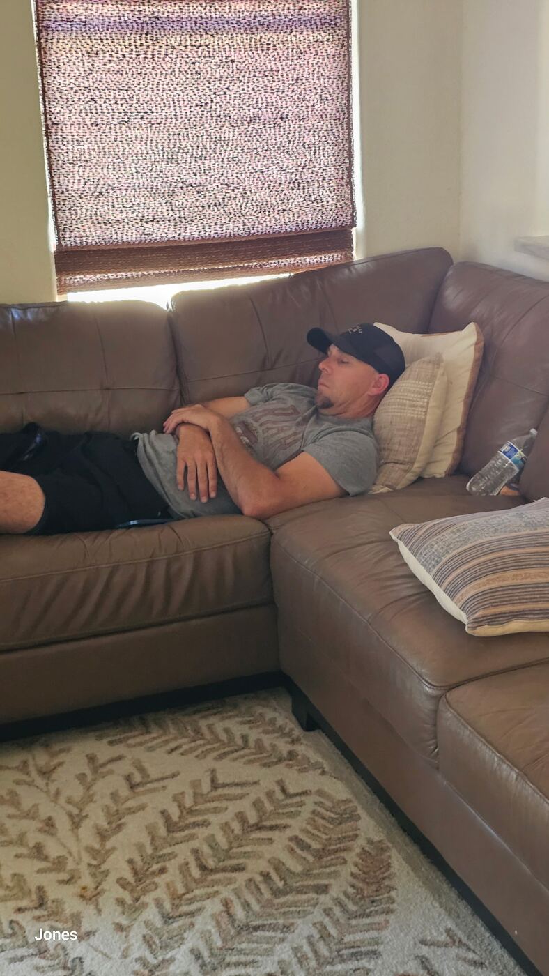 Mid-day couch nap — earned rest between rounds