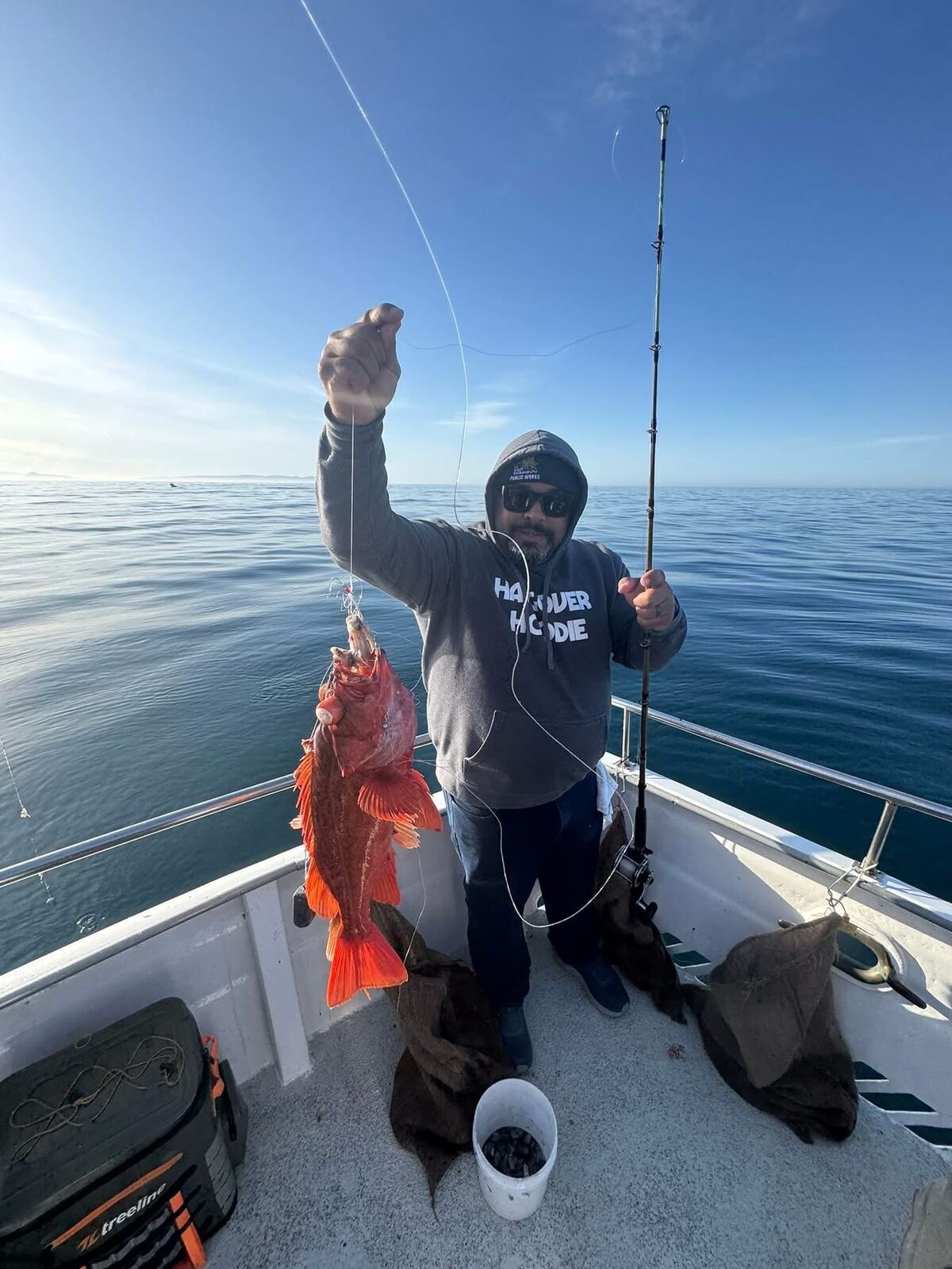 Bright orange rockfish hauled up off the rail in the Hangover Hoodie