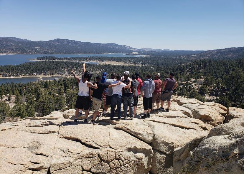 The crew turned to the lake — pointing out the next ridge