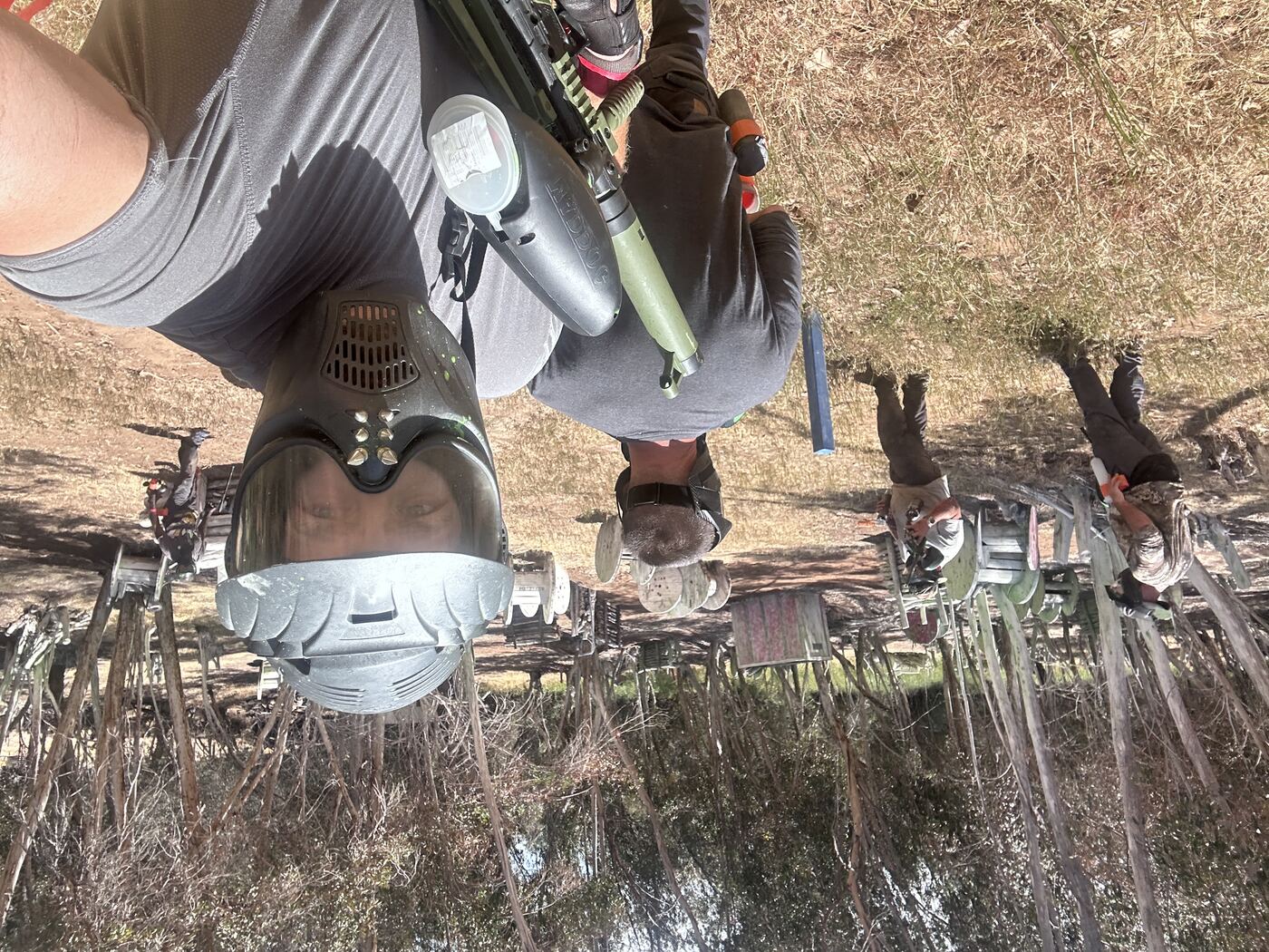Mask-on selfie from the field — eyes locked in mid-game