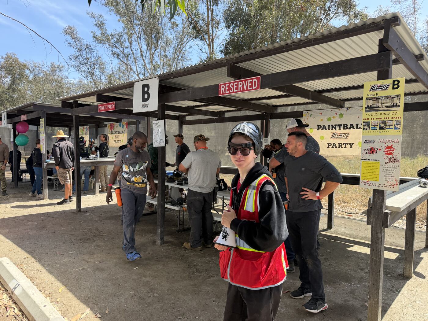 Ref checking us in at Station B — paintball party in motion