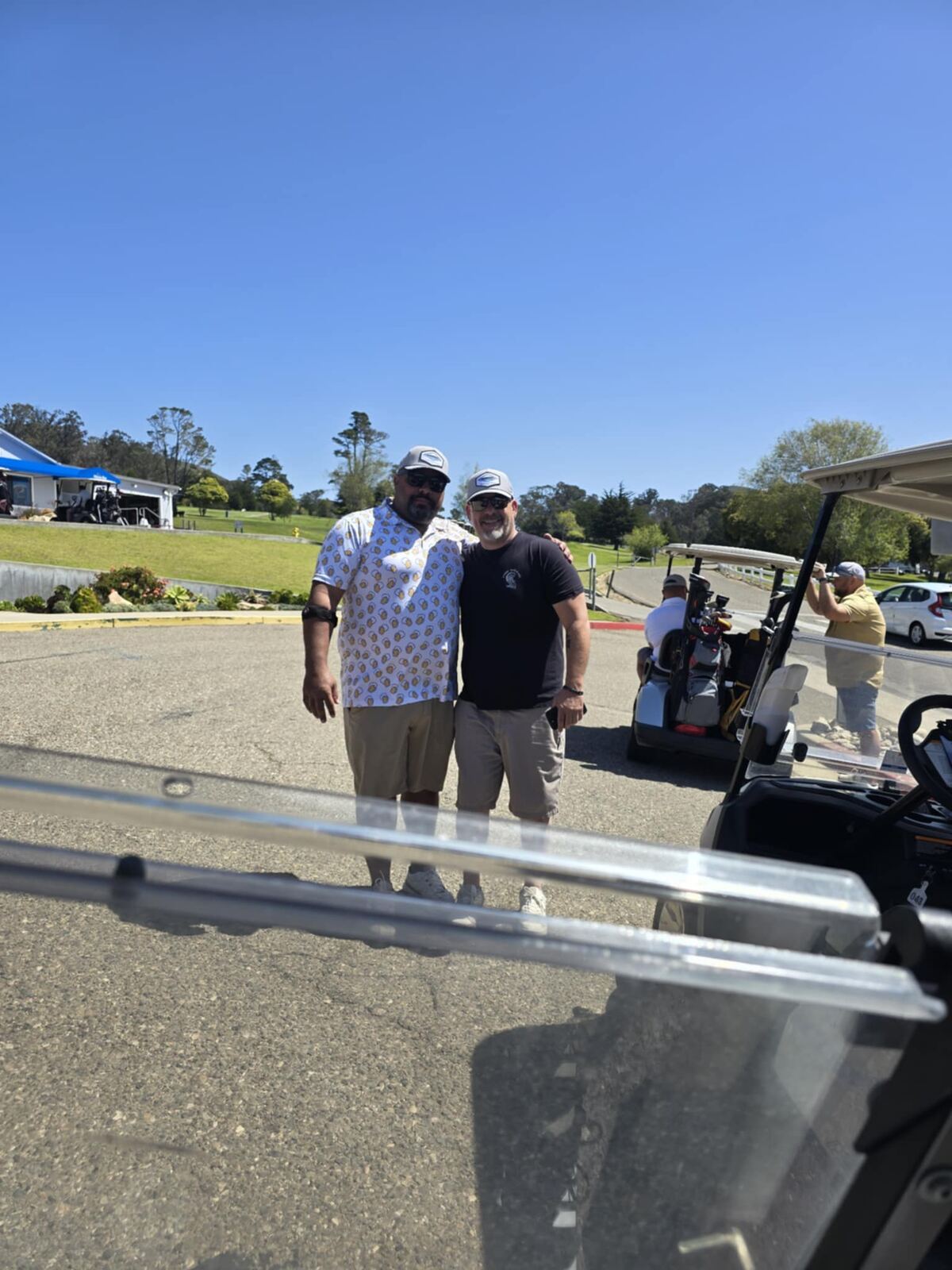 Clubhouse parking lot pose before the round