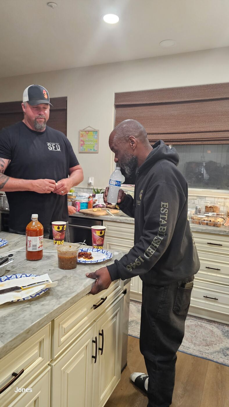 Late-night kitchen snack — SFD tee, hot sauce out, brothers fueling up