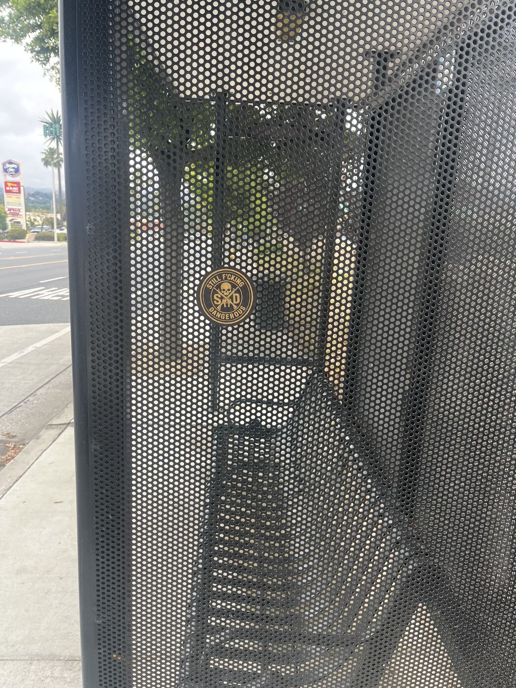 SFD sticker spotted on a city mesh panel — stickers in the wild
