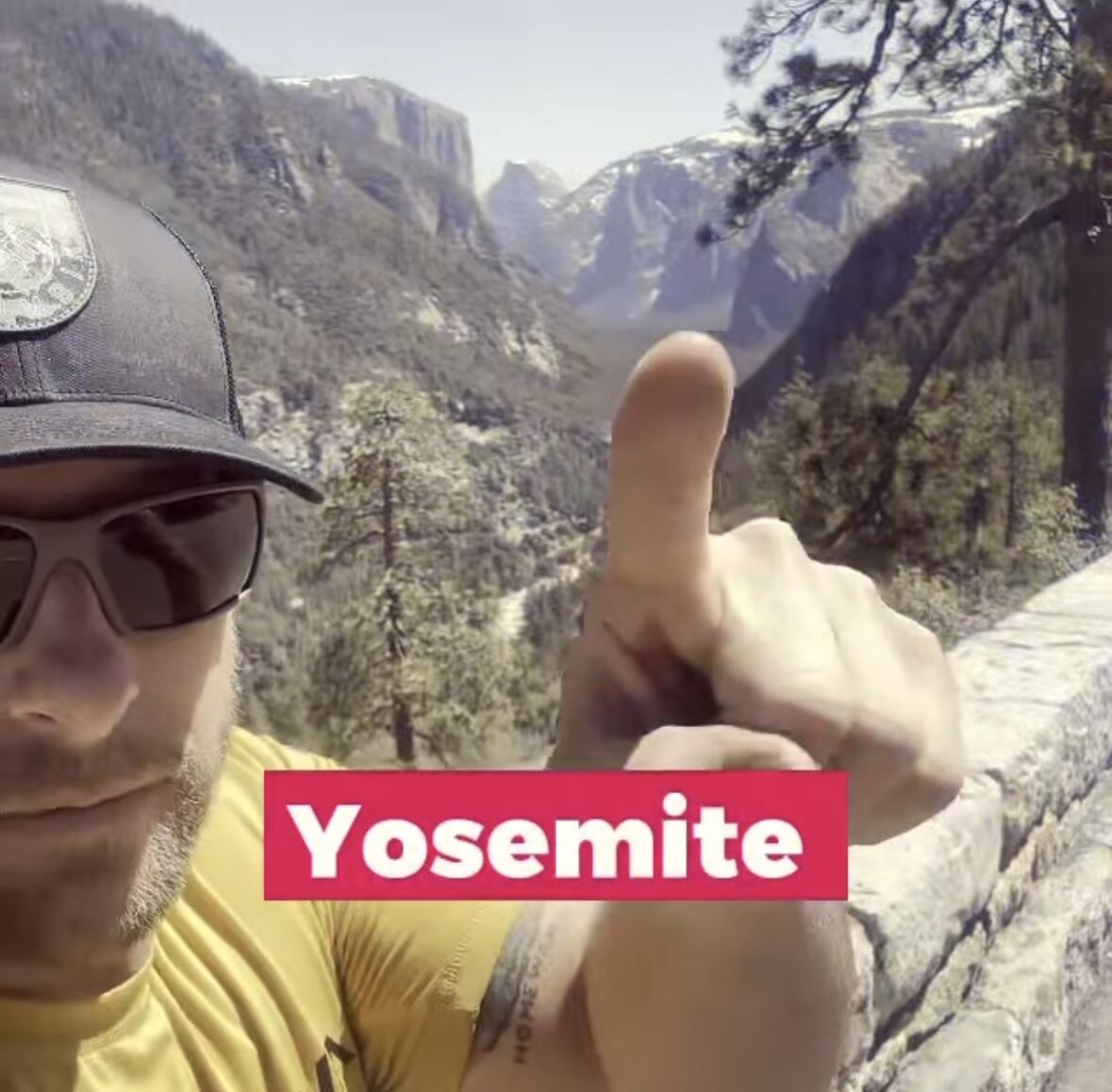Yosemite tunnel view thumbs-up — El Capitan and Half Dome over the shoulder